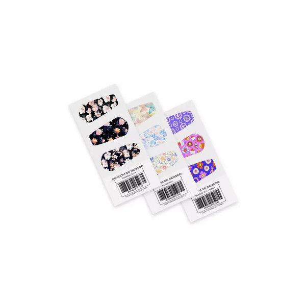 Dexcom Stickers Spring Edition 2025 featuring floral, pastel, and bold patterns on vinyl-laminated sheets.