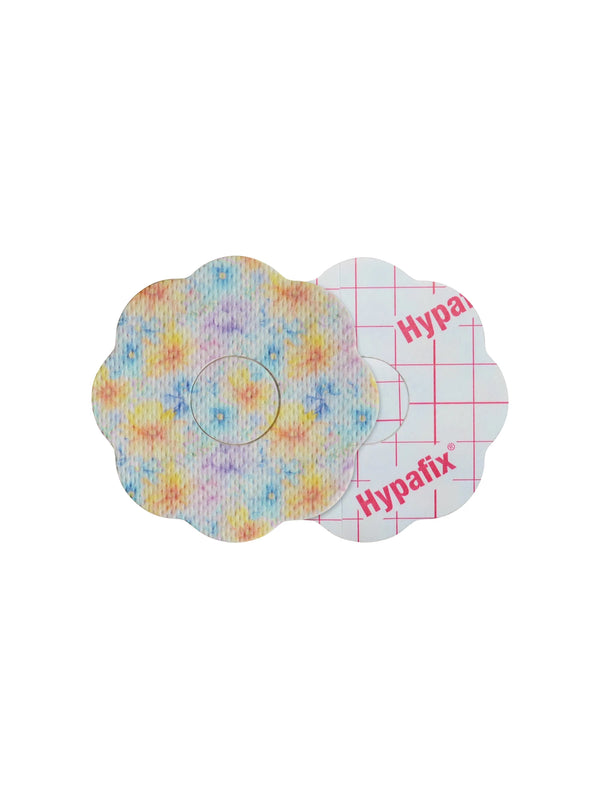 FreeStyle Libre 3 cookie shape patch front and back view, showing printed fabric and adhesive side for sensor support