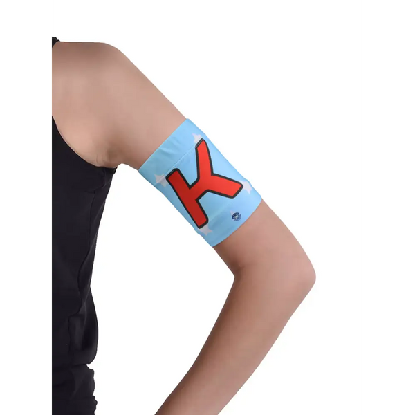 Glucose monitor and insulin pump armband in blue with red design worn on upper arm