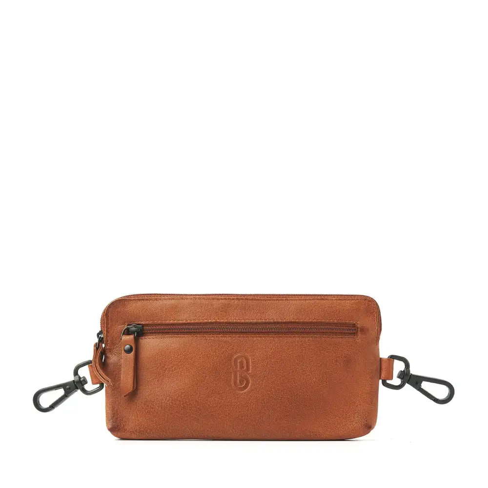 Stylish brown leather waist pack with zippers and hooks for insulin pump storage.
