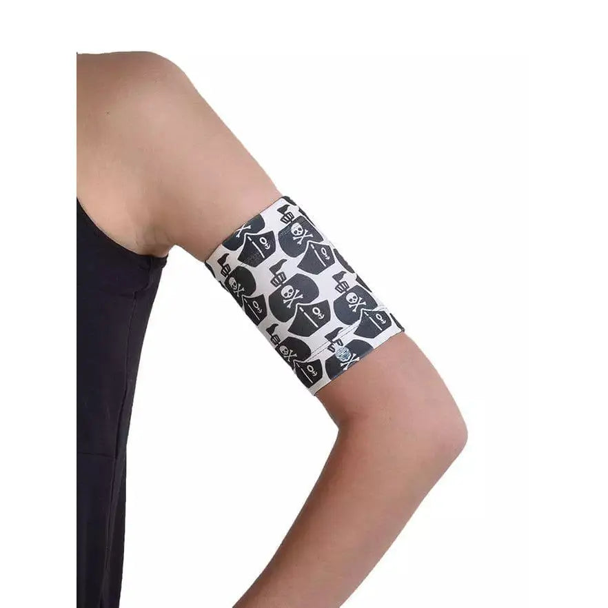 Kids' armband for blood glucose sensor, reusable, fun patterns, stretchy fit.