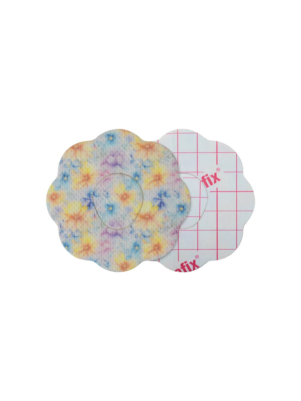 Dexcom G7 cookie shape patch front and back view, showing printed fabric and adhesive side for sensor support