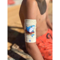 Sensor protective armband for kids with type 1 diabetes featuring a shark design.