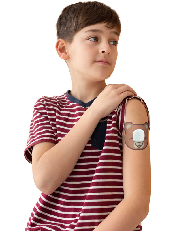 Simplera Sync bear patch worn by boy child friendly CGM adhesive patch designed for daily activities