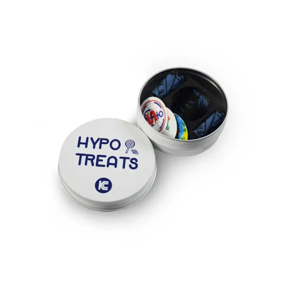 A tin container labeled "HYPO TREATS" with a few candies visible inside, designed for people managing hypoglycemia.