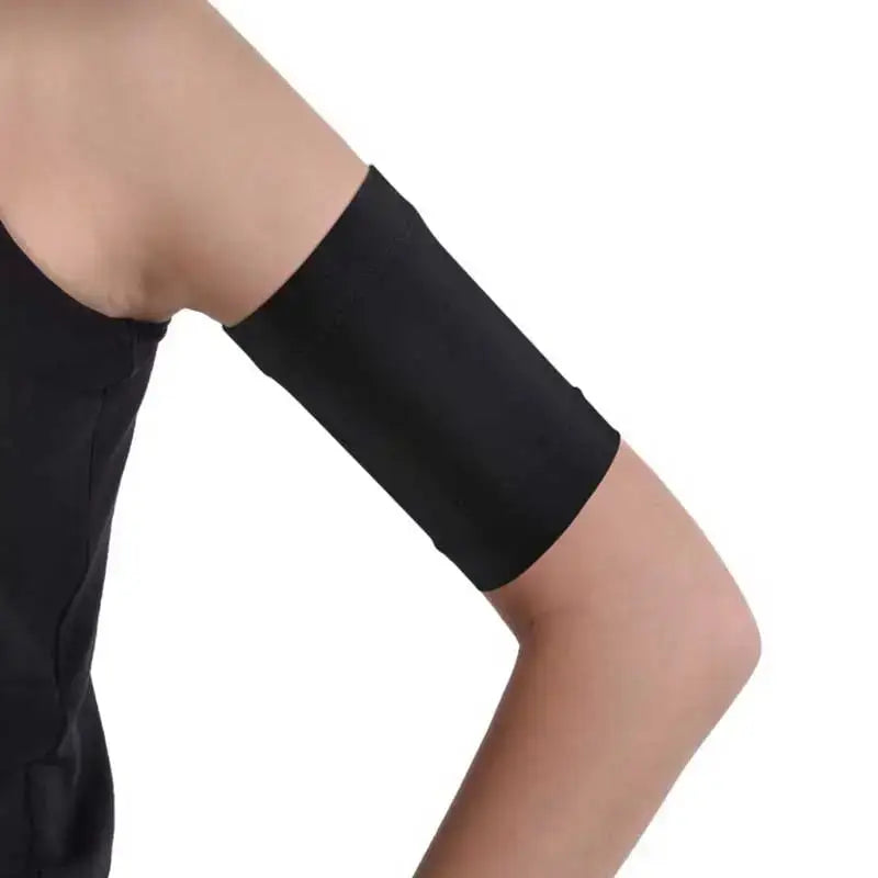 Child wearing black glucose sensor armband for Dexcom and Freestyle Libre.