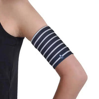 Striped CGM arm band for glucose sensor and insulin pump on upper arm.